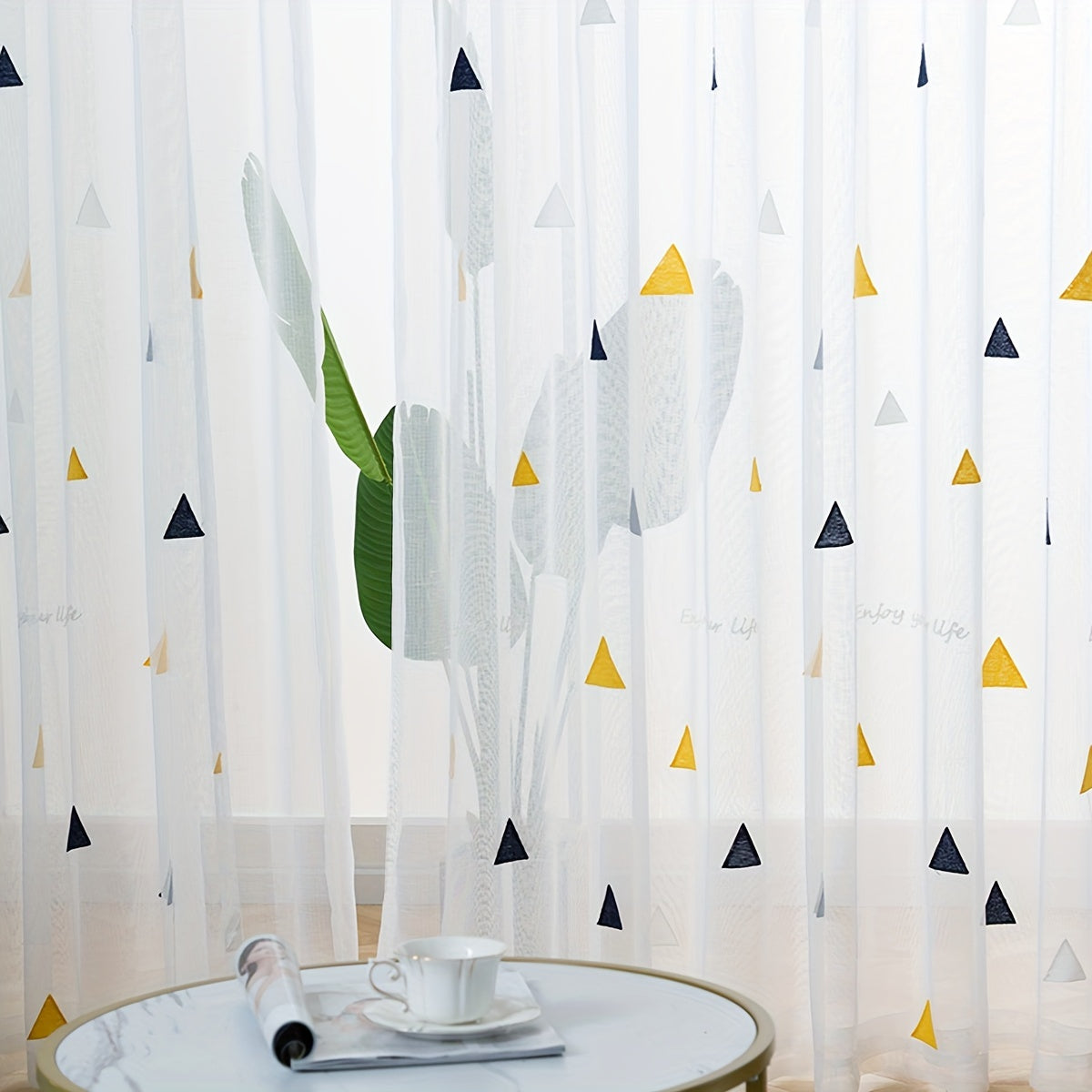 Modern geometric triangle sheer curtains in white polyester with an arts & crafts theme, suitable for girls room, living room, or bedroom. Machine washable, unlined, and featuring a decorative rod pocket embroidered panel.