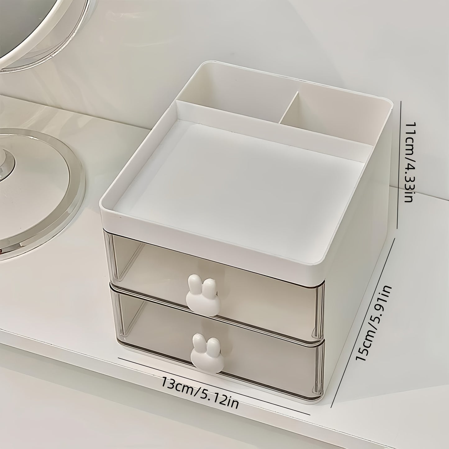 Chic white cosmetic storage box with rabbit handles, 2-drawer desktop organizer for makeup, jewelry, and office supplies. Transparent compartments, lightweight, and easy to assemble. Ideal gift for women.