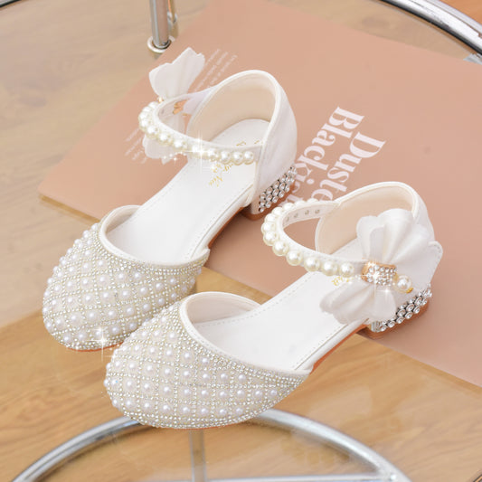 Glitter princess shoes for girls with rhinestones, pearl bow, block heel, non-slip sole and insole. Ideal for school, dance, wedding, and party. Spring/Fall collection for ages 14 and under.