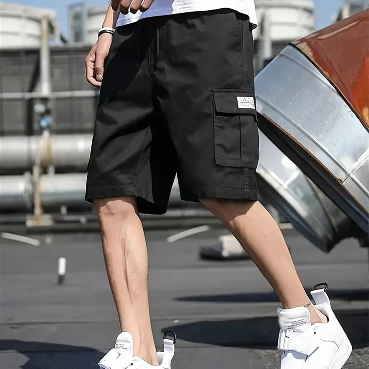 Men's plus-size cargo shorts made of lightweight polyester with pockets, drawstring waist, and suitable for basketball and streetwear.