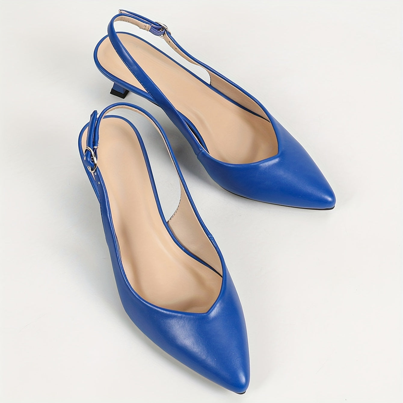 Stylish women's slingback shoes with pointed toe, mid-heel, solid color, and faux leather cover on rubber sole.