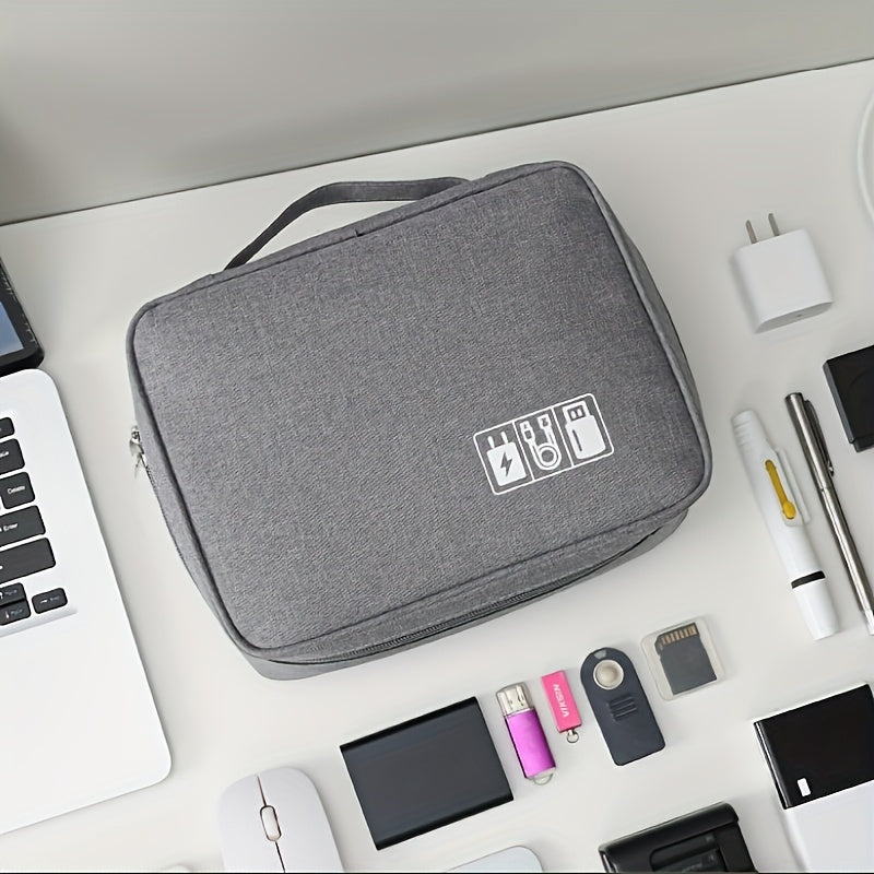 Polyester organizer bag stores digital accessories, cables, headphones, hard drive, power cord, and makeup.