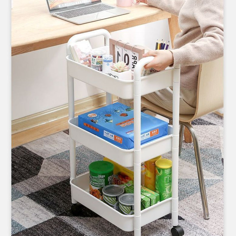 Three-tier rolling corner organizer cart that swivels 360 degrees for effortless mobility. Made of durable plastic, this cart requires no power and features wheels for easy movement in the kitchen, bathroom, living room, or office.