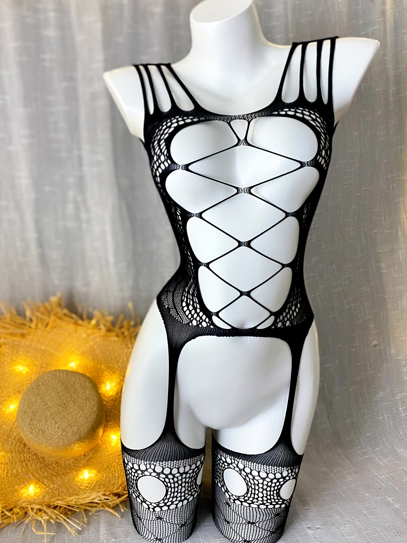 Black & white lace bodysuit for women with sexy hollow-out design, open crotch, and high-stretch blend. See-through stocking ideal for festivals and beachwear.