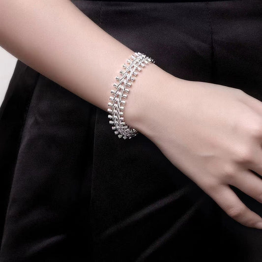 This bracelet is made of high-quality S925 sterling silver featuring a double bead chain design. It is beautifully crafted with exquisite silver detailing, embodying a fashionable retro style. This versatile piece is perfect for everyday wear or special