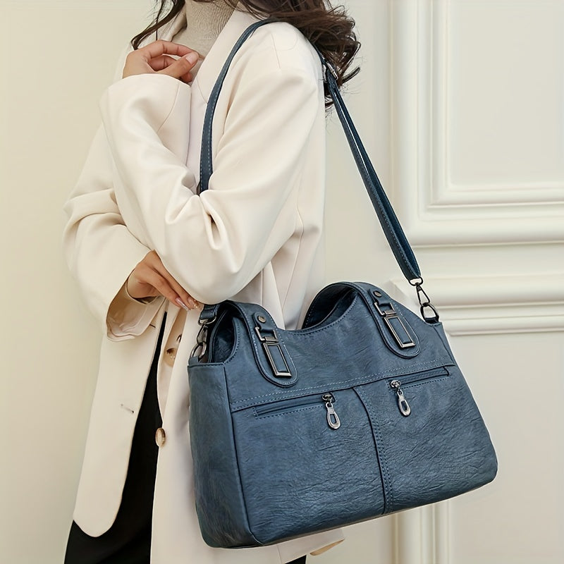 Stylish women's crossbody bag with multiple pockets, detachable strap, chic design, zip closure, and polyester lining.