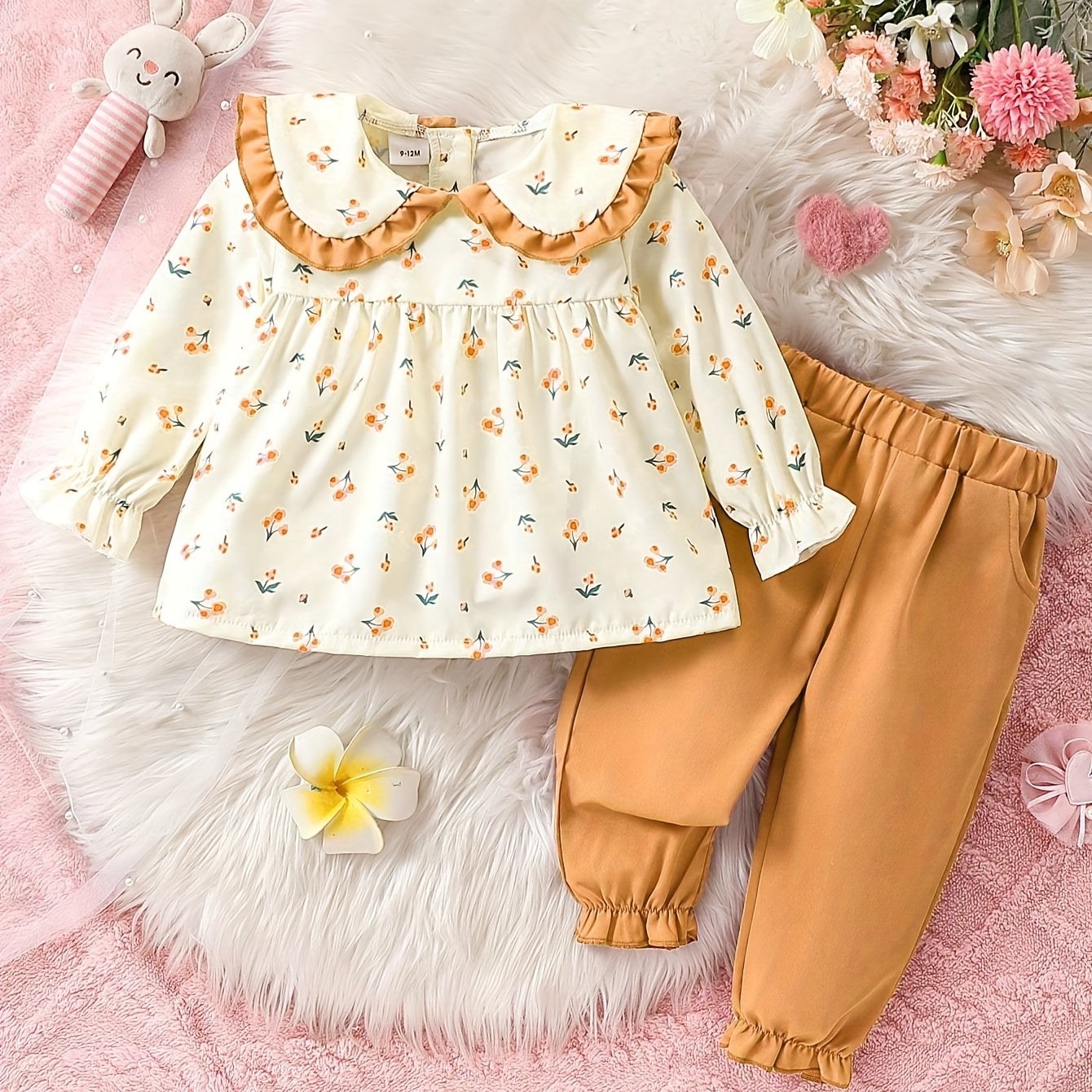 Cute baby girl outfit with floral top and pink jogger pants set - ideal for spring/autumn and parties. Made of polyester, machine washable and perfect for casual outdoor wear.