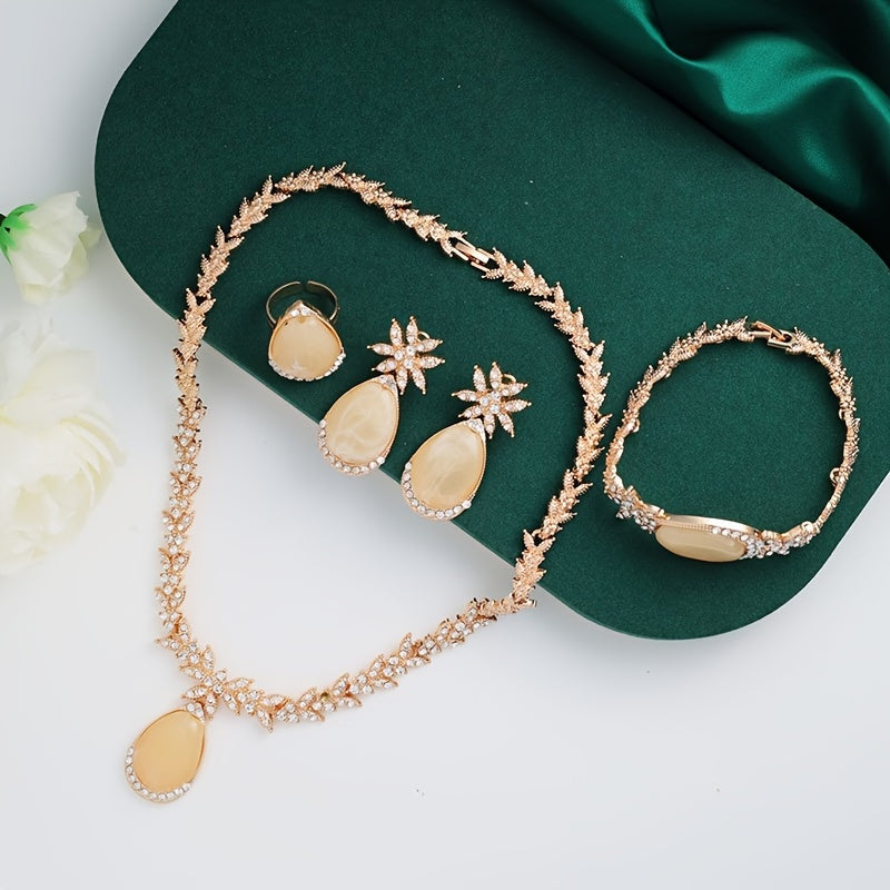 Experience luxury with our 18K Gold Plated Alloy Jewelry Set adorned with sparkling rhinestones. This 4-piece set oozes elegance and is perfect for your vacation outfits. Ideal for weddings, gifts, and Valentine's Day, our Gold Plated Bridal Party Sets