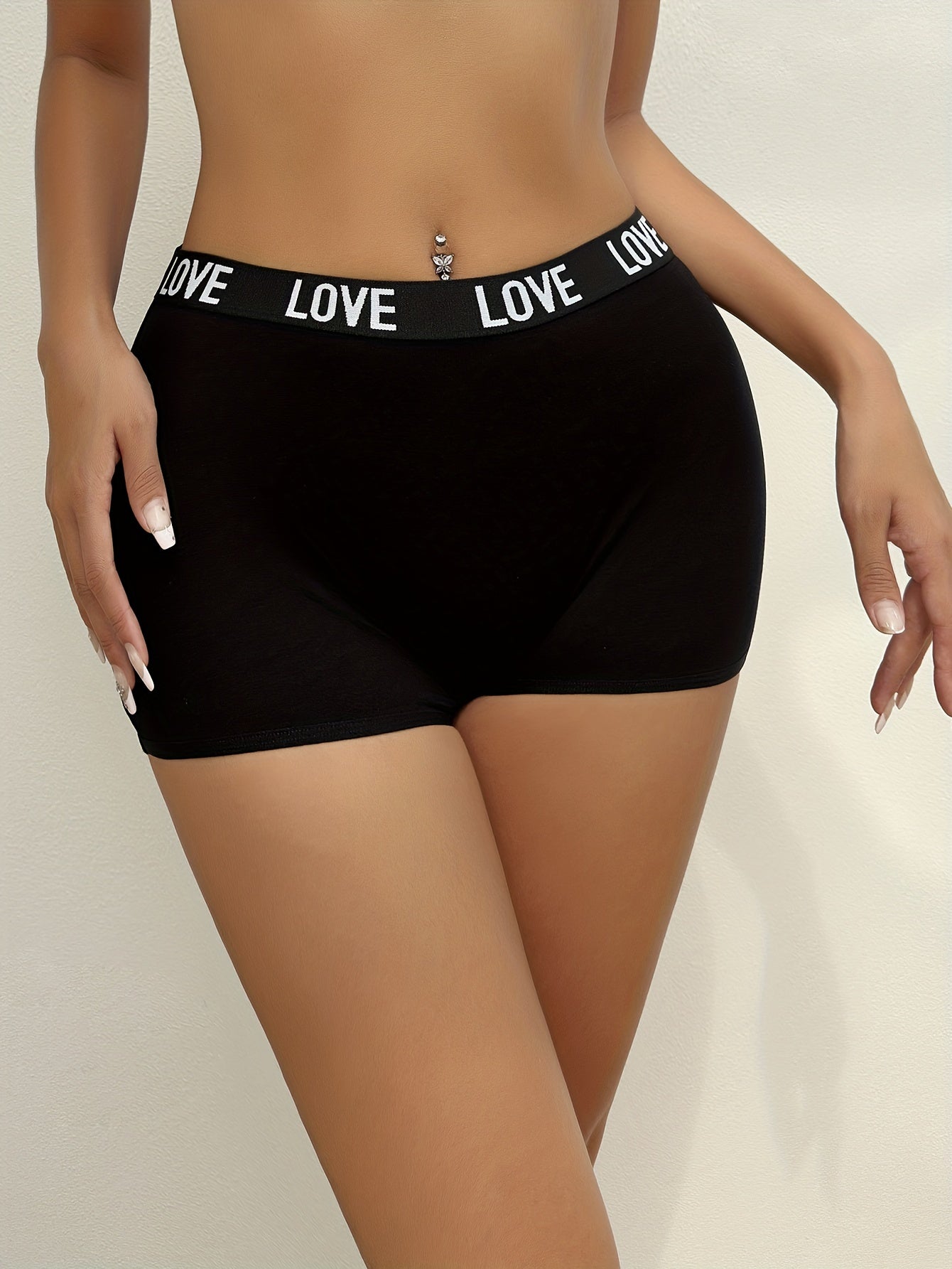 Set of 3 letter print boyshort panties for women, made of soft and stretchy materials for sports and comfort.