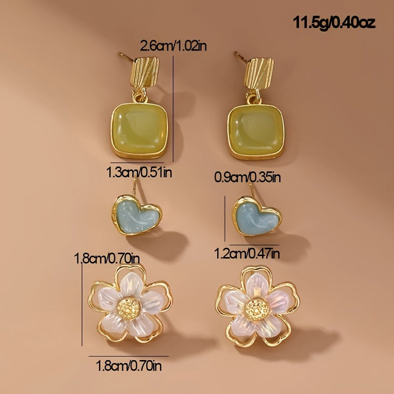 Stylish 3-piece earring set for women featuring pearls, flowers, and geometric designs. Made of fashion alloy with synthetic zirconia, inspired by Japanese and Korean fashion. Suitable for