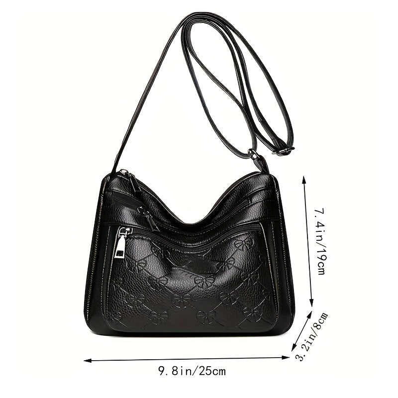 Trendy black crossbody bag for women with adjustable strap, floral design, and zipper closure, ideal for daily use.