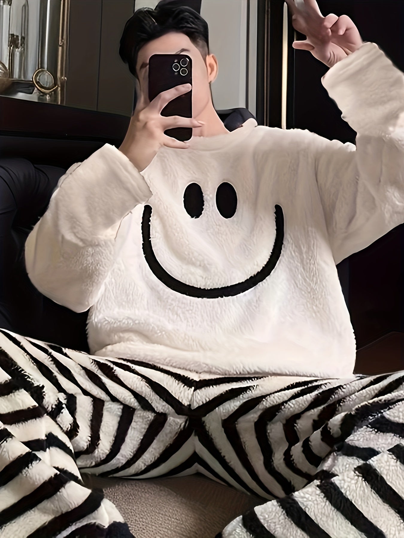 Men's casual style cartoon embroidered pajama set with long sleeve crew neck top and regular fit pants. Made with warm fleece fabric for fall/winter sleepwear.