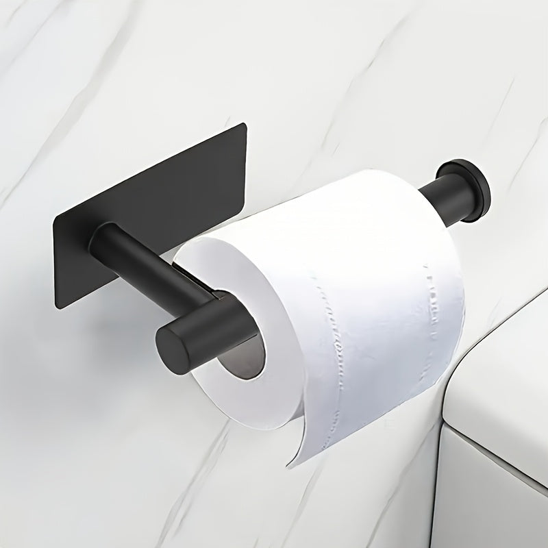 Stainless steel self-adhesive toilet paper holder.