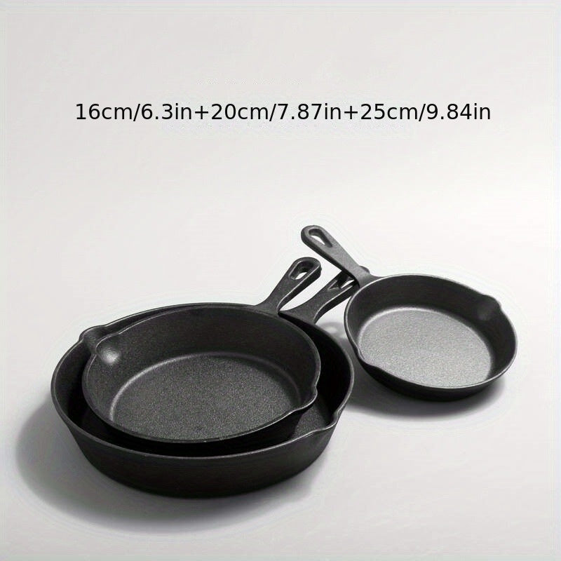 Three-piece seasoned cast iron pan measuring 16, 20, and 25cm in size. This durable cookware features easy tipping sides and auxiliary handles, making it perfect for both indoor and outdoor cooking.