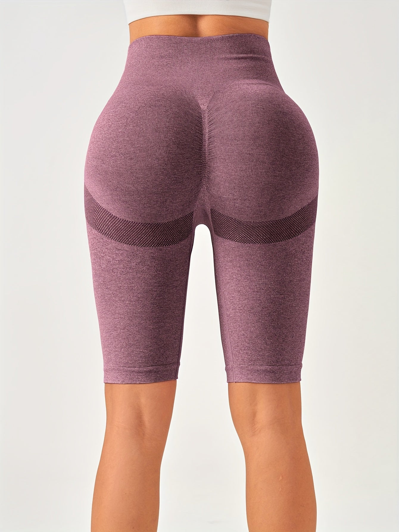 Solid color knitted yoga fitness pants for women with high waist, hip lift, and tight belly.