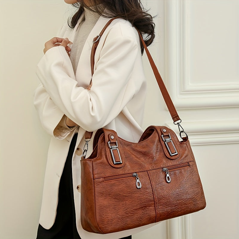 Stylish women's crossbody bag with multiple pockets, detachable strap, chic design, zip closure, and polyester lining.