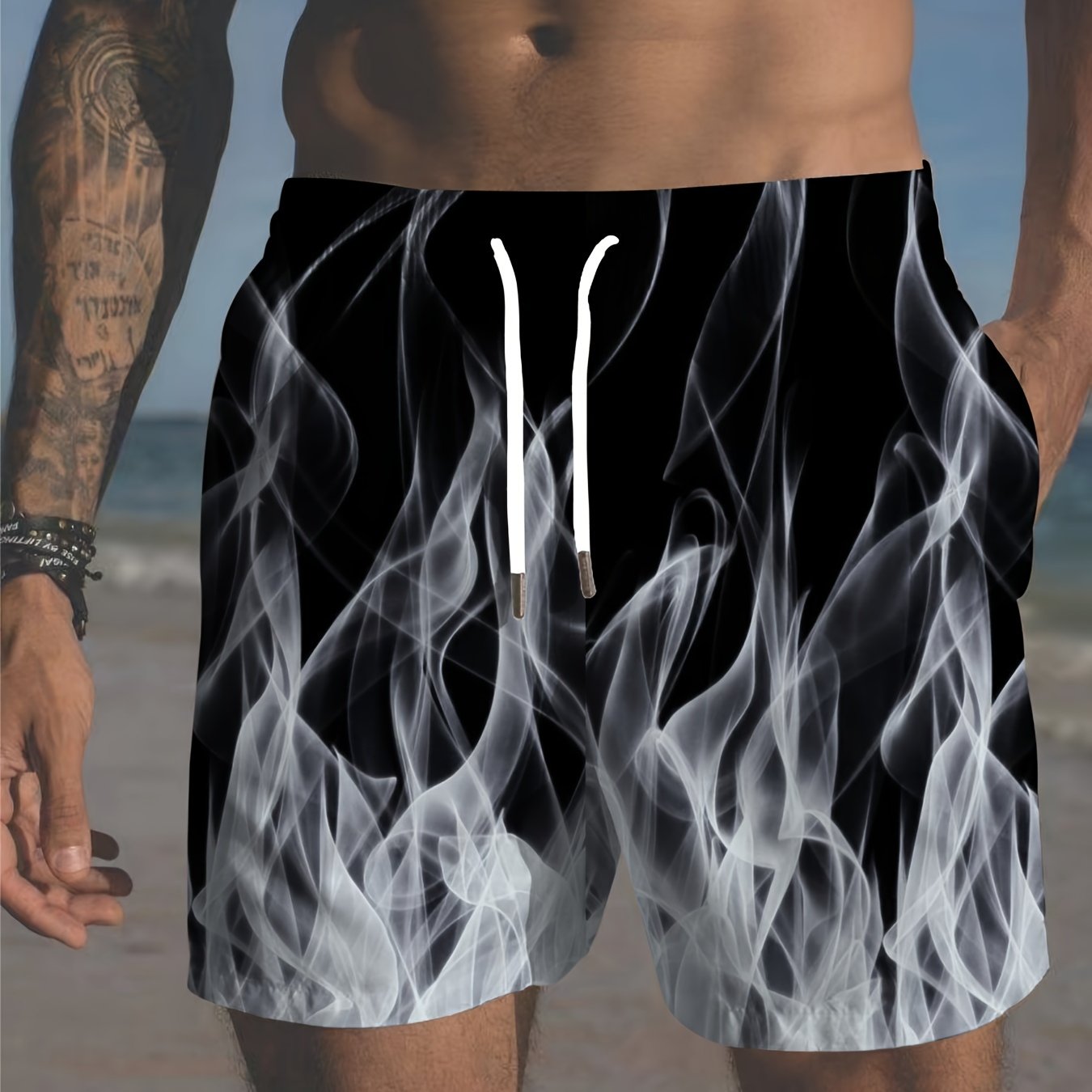 Large men's flame print beach shorts with Hawaiian style, breathable and casual for streetwear or swimming.