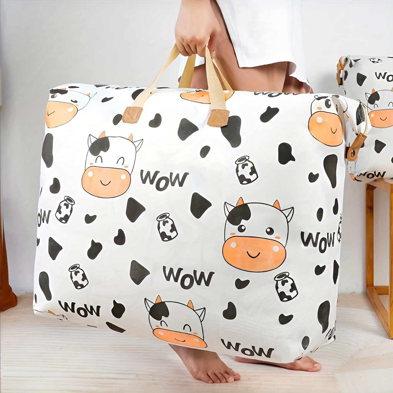 Large capacity polyester storage bag with cute cow print design for adults. Perfect for moving and organizing. Features a handle for easy portability. Measures 14+ inches.