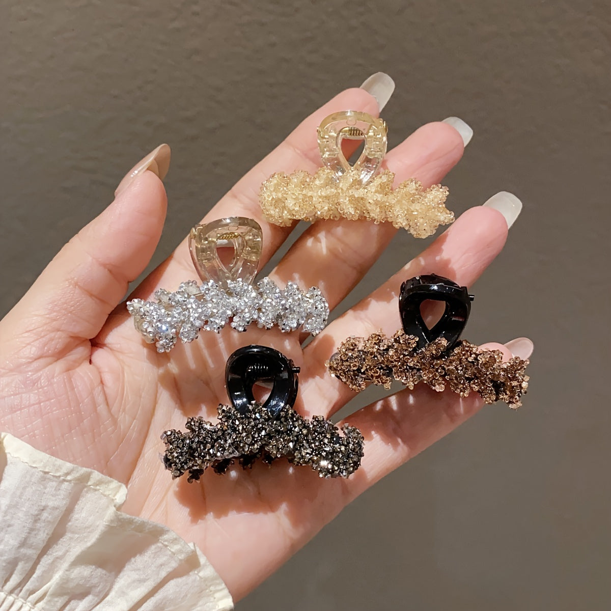 4 elegant rhinestone hair claw clips with small wheat sheer design in black, brown, and clear.