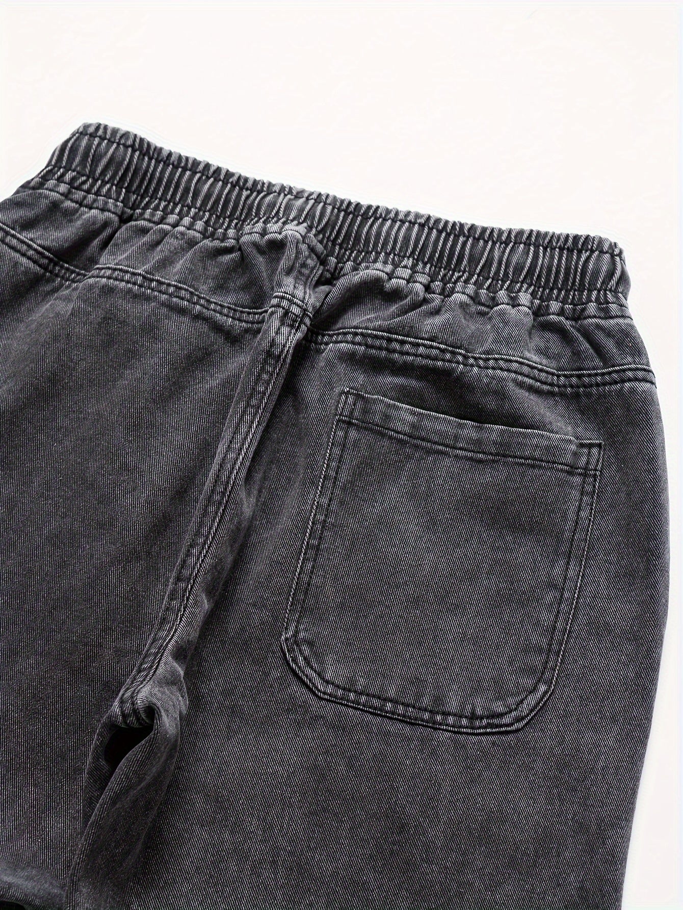 Mens' washed denim trousers with pockets and drawstring waist for outdoor activities