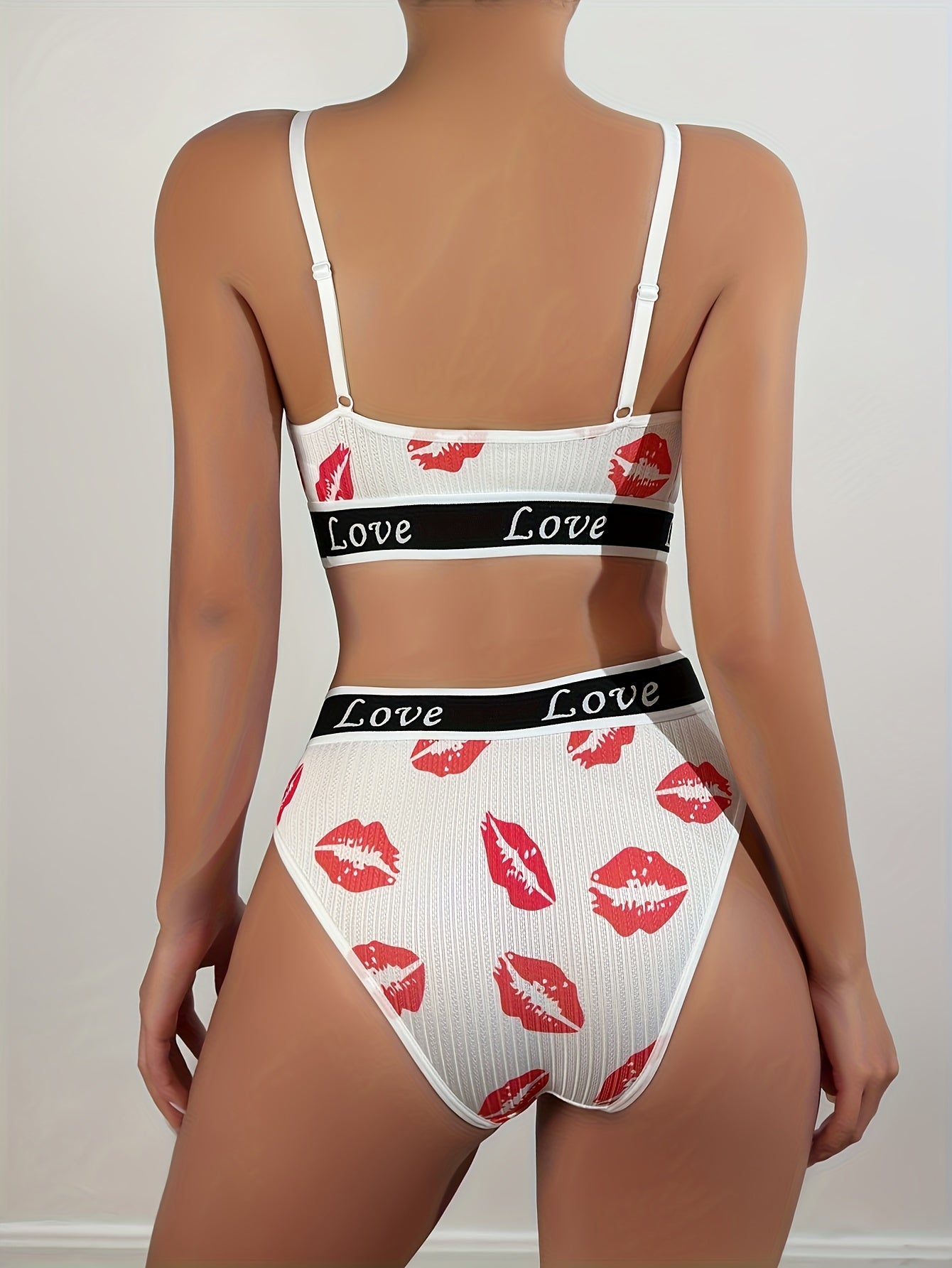 Valentine's Day themed lingerie set with red lips print and LOVE letter tape design.