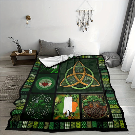 Soft Flannel Fleece Blanket featuring a Contemporary Celtic Design with Triquetra and Clover Motifs, Perfect for Seasonal Comfort. Ideal Home Gift in Green and Black.