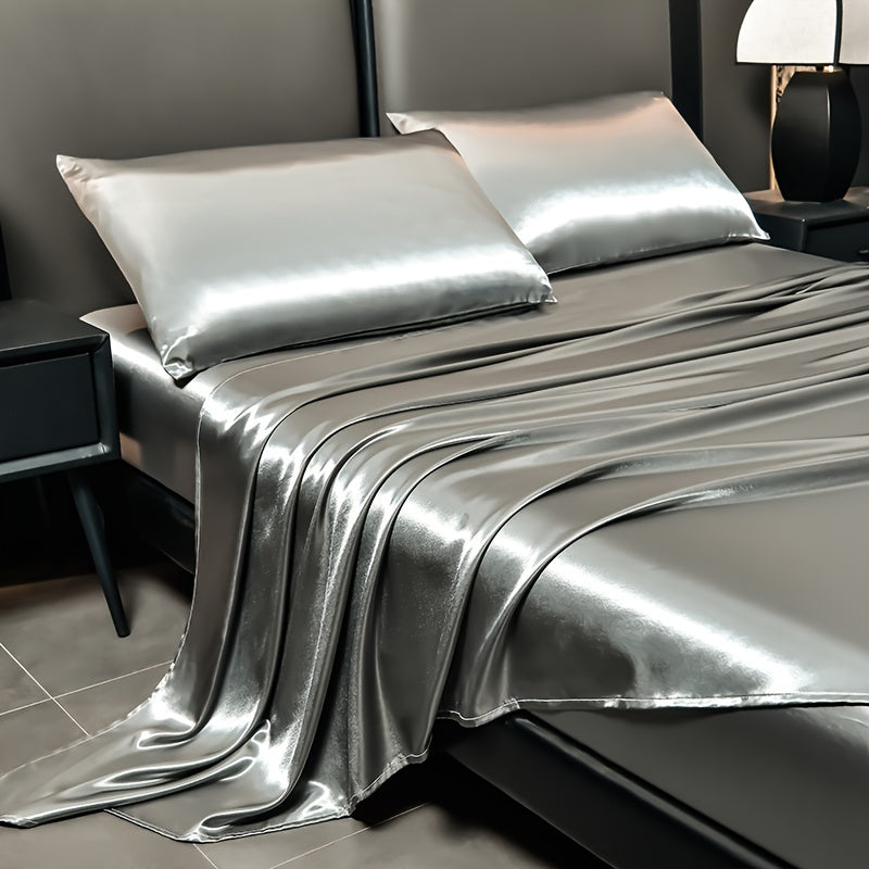 4-piece deluxe satin bed sheet set includes 1 flat sheet, 1 fitted sheet, and 2 pillowcases. Made of high-quality satin, it is bright, non-slip, breathable, reversible, and retains its new