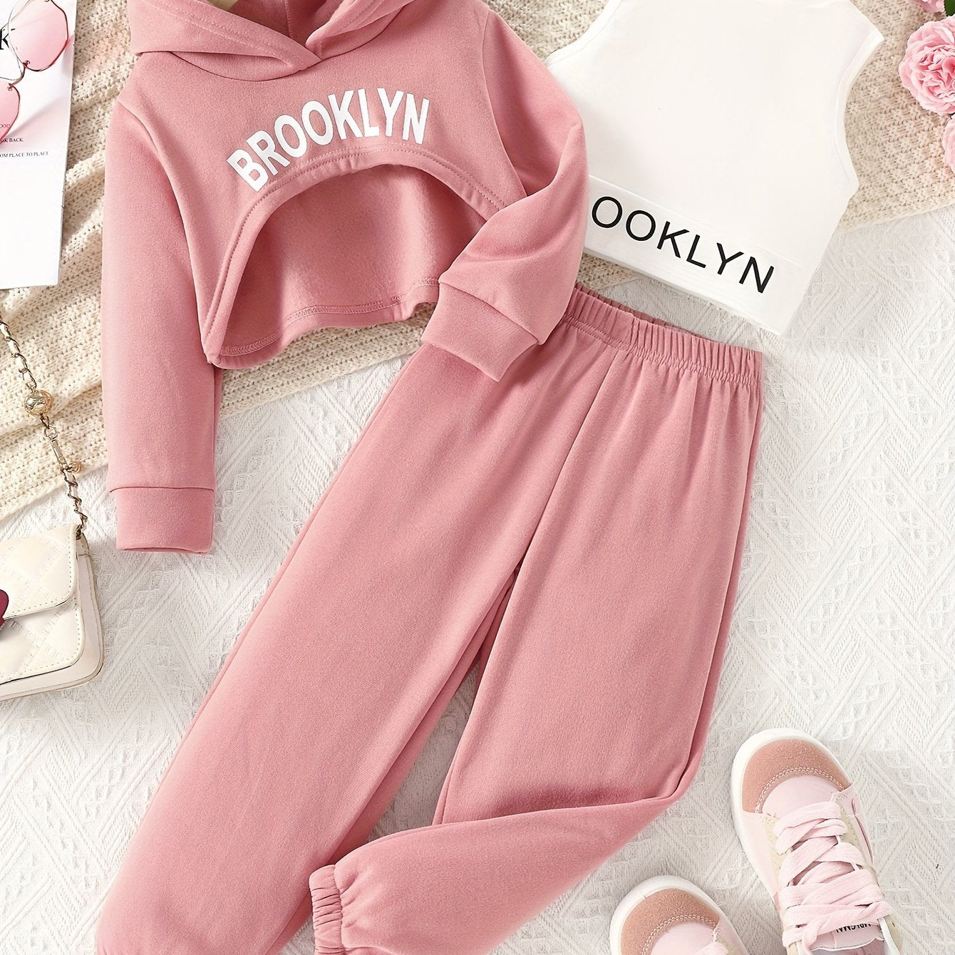 Stylish girls' outdoor clothing set for spring and autumn includes a hooded sweatshirt, vest, and pants with letter print. Perfect for casual or special occasions.