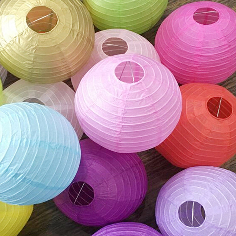 10 festive 7.9 inch paper lanterns in random colors for holidays and celebrations.