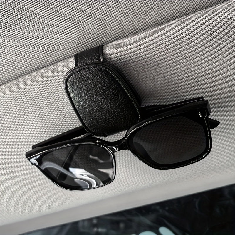 Universal car sun visor clip made of PVC material for storing eyeglasses in the vehicle interior.