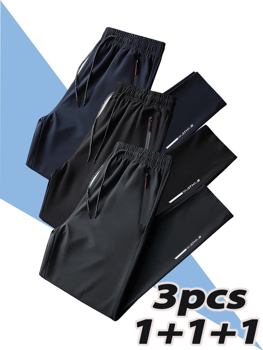 Three men's polyester sports track pants with zipper for running, training, hiking, and casual wear in spring/summer.