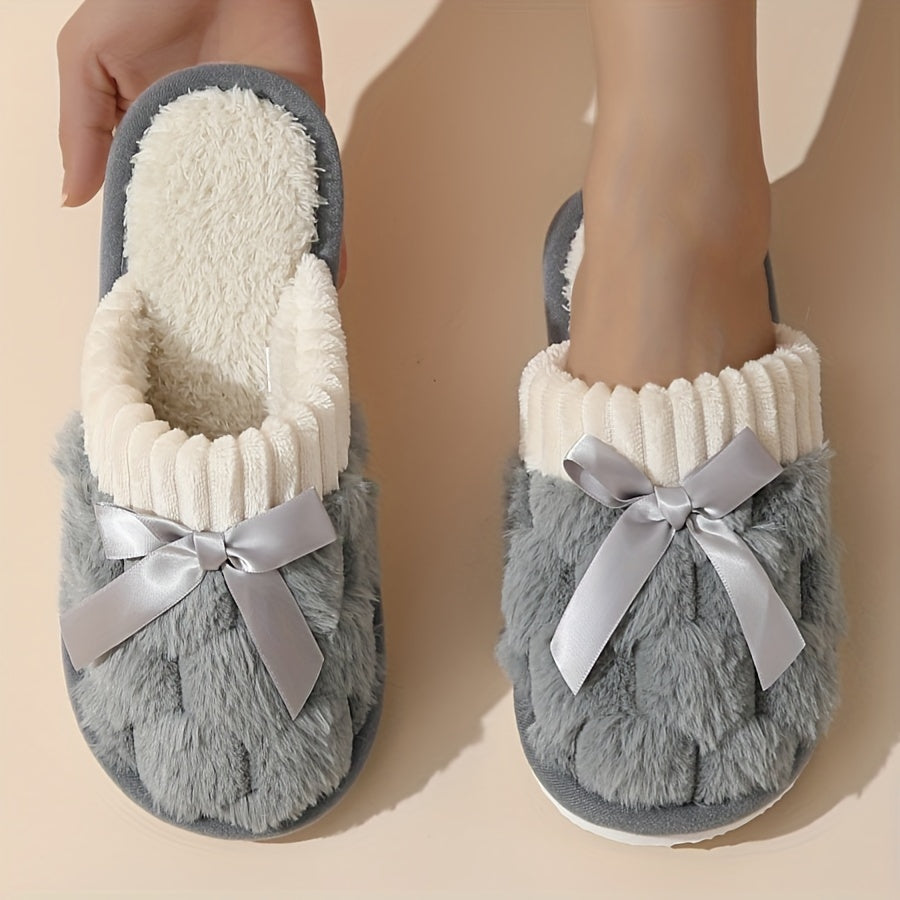 Winter plush cozy non-slip shoes with soft sole and flat bowknot decoration, ideal for home warmth.