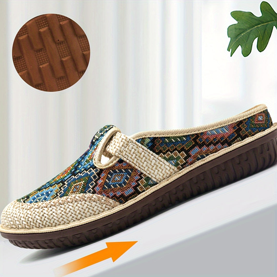 Women's printed slip-on mules with soft, lightweight soles.