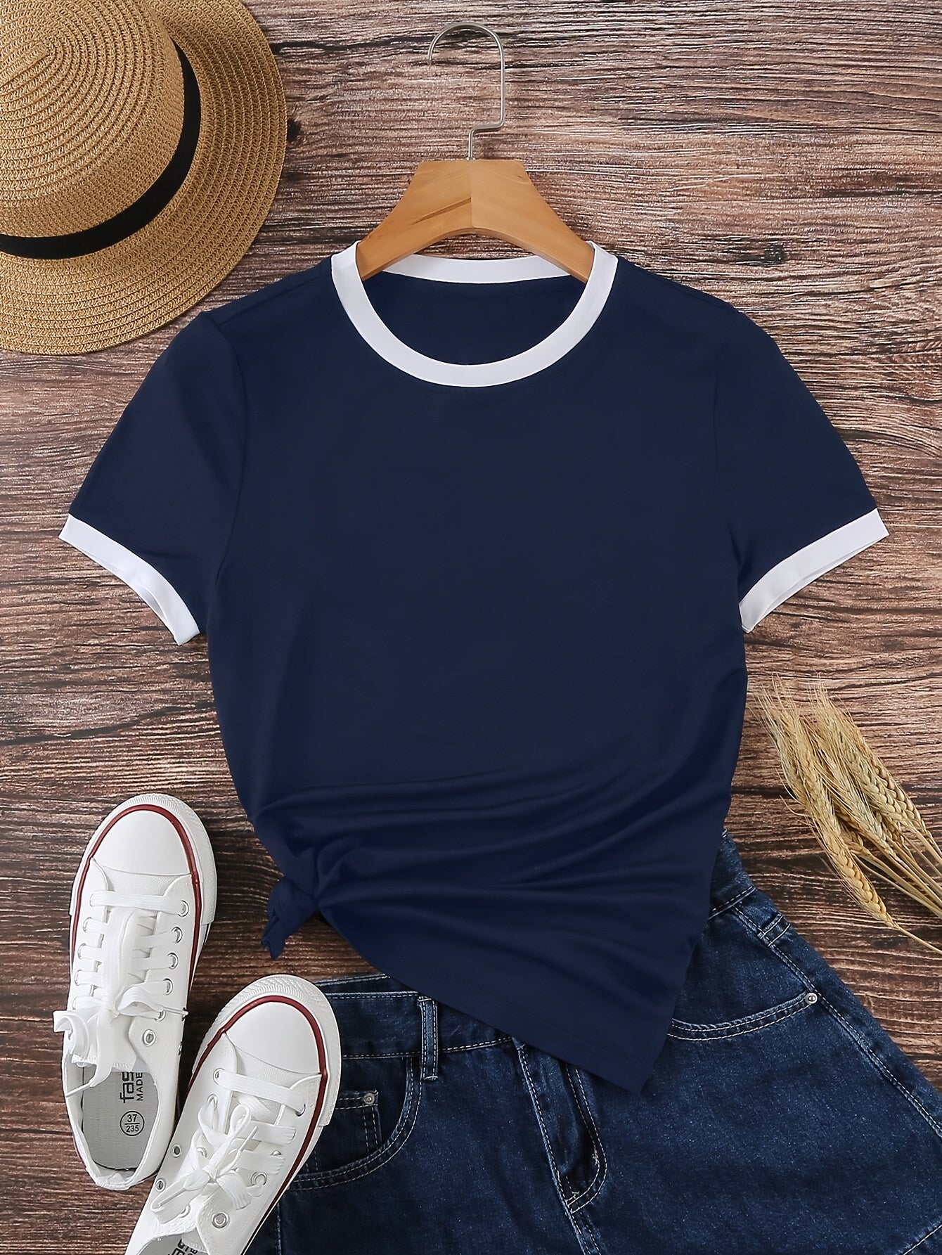 Summer women's sports t-shirt, solid color, medium stretch polyester knit fabric, casual round neck with color block detail.