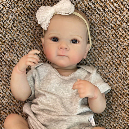 20" lifelike waterproof vinyl reborn girl doll with realistic 3D painted skin and hand-painted hair. Bathable and comes in a comfy gray outfit with headband. Perfect for girls.