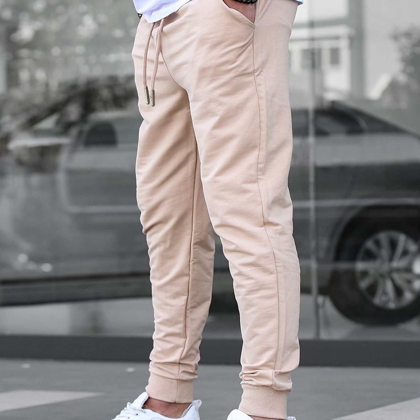 Solid color jogger pants for men with drawstrings, lightweight and breathable for running and fitness.