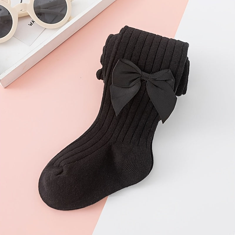 Adorable bow-knot girls' leggings socks in soft ribbed knit, perfect for dance and casual attire. Available in various colors.