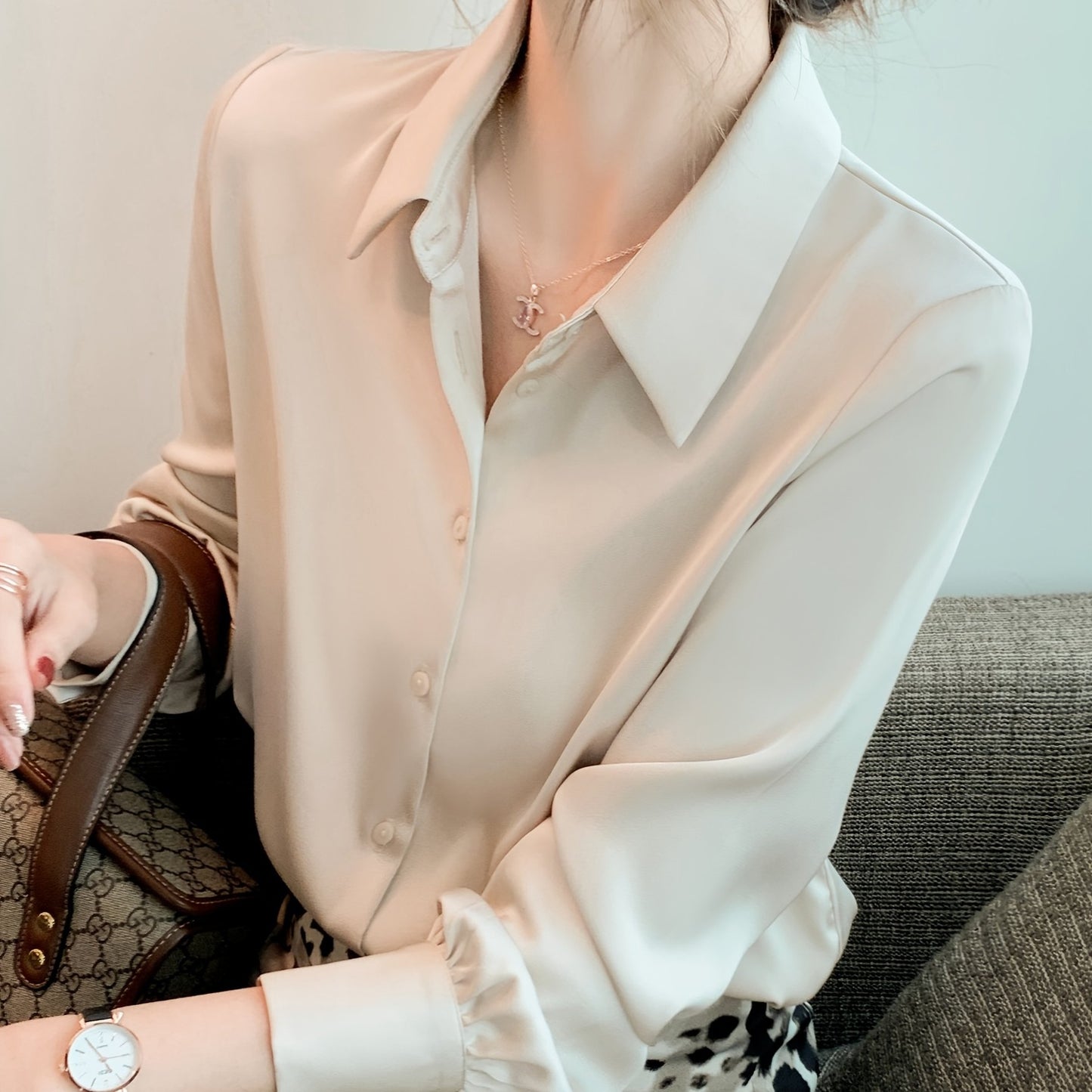 Women's chic solid color long sleeve blouse made of 100% polyester with lapel collar and button details. Suitable for all seasons.