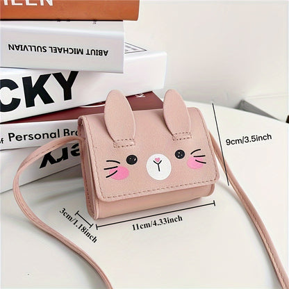 Cute bunny-themed mini crossbody bags in faux leather with adjustable strap. Includes cartoon coin purse and shoulder handbag in various colors. Bunny accessories available.