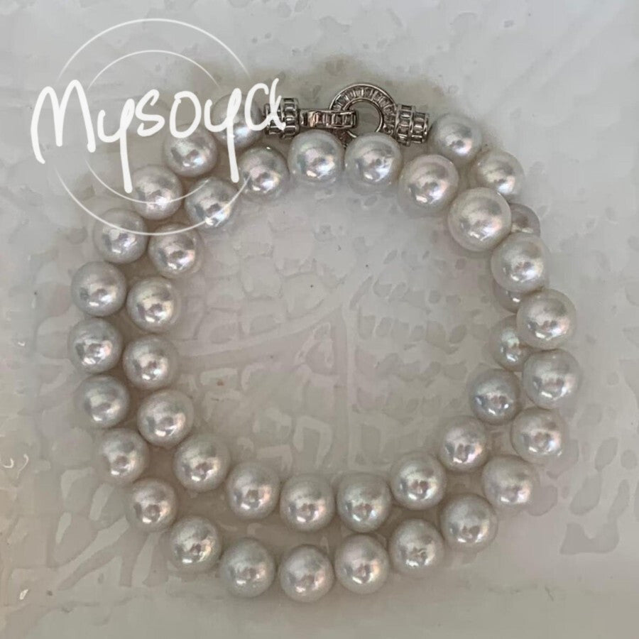 Elevate your style with the MYSOYA Elegant Large Natural White Pearl Necklace, featuring stunning 9-10mm pearls. This necklace comes in an exquisite gift box, making it perfect for any occasion - from daily wear to parties, birthdays, anniversaries