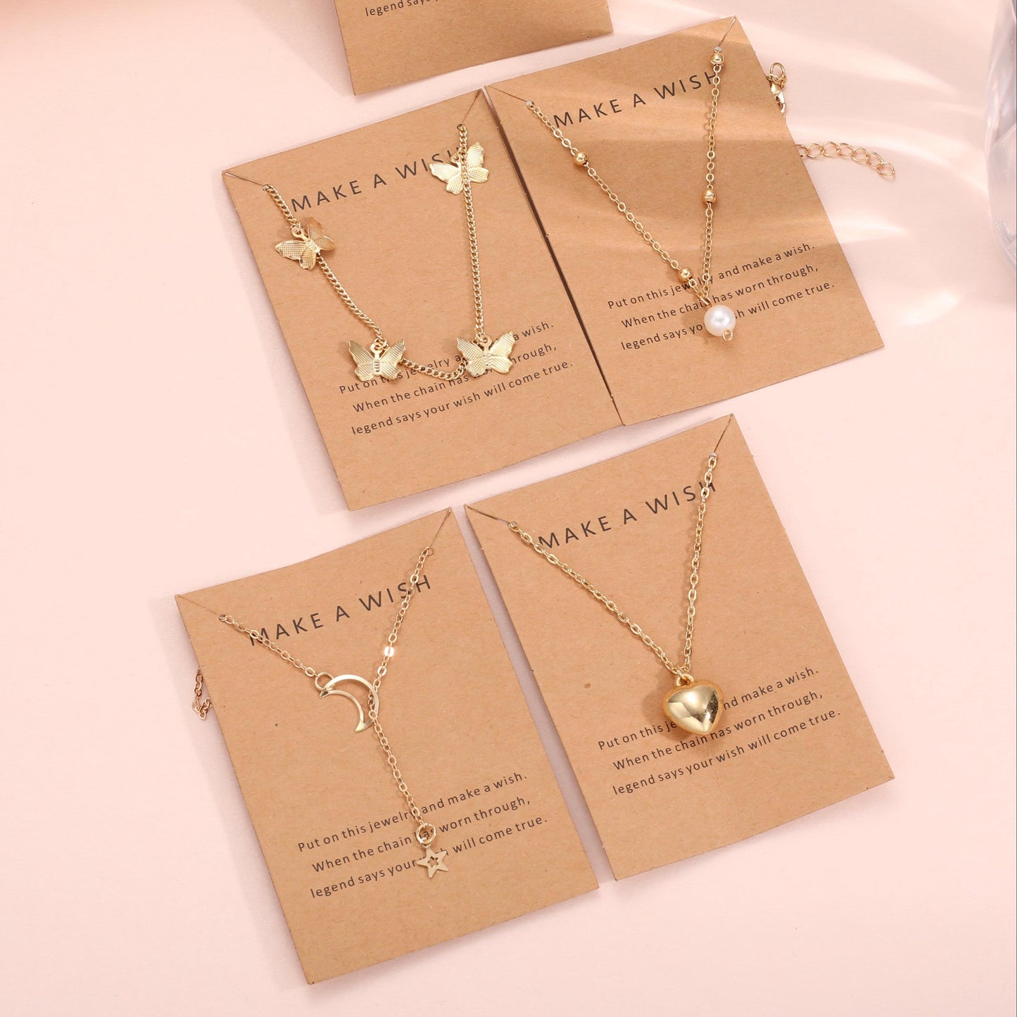 Set of 6 elegant pendant necklaces with butterfly, star, moon, and heart charms. Made of zinc alloy with no plating. Versatile fashion jewelry for women, perfect for daily wear or vacation.