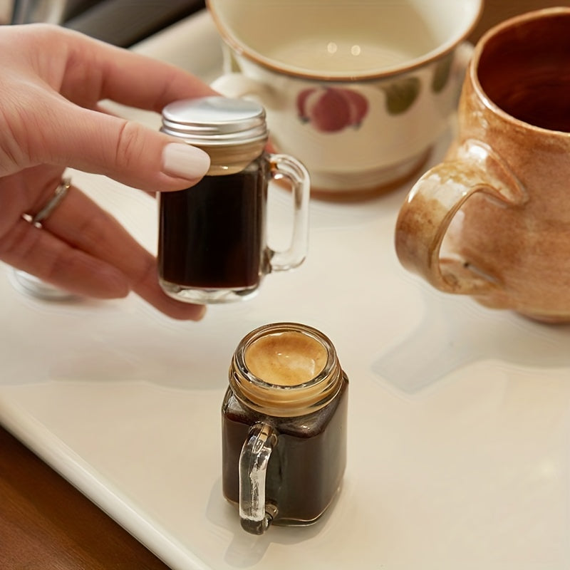 Mini Mason jar shot glass with lid, leakproof glass, ideal for home, parties, and bars. Perfect for beverages such as coffee, milk, juice, honey, and jam. Hand wash only.