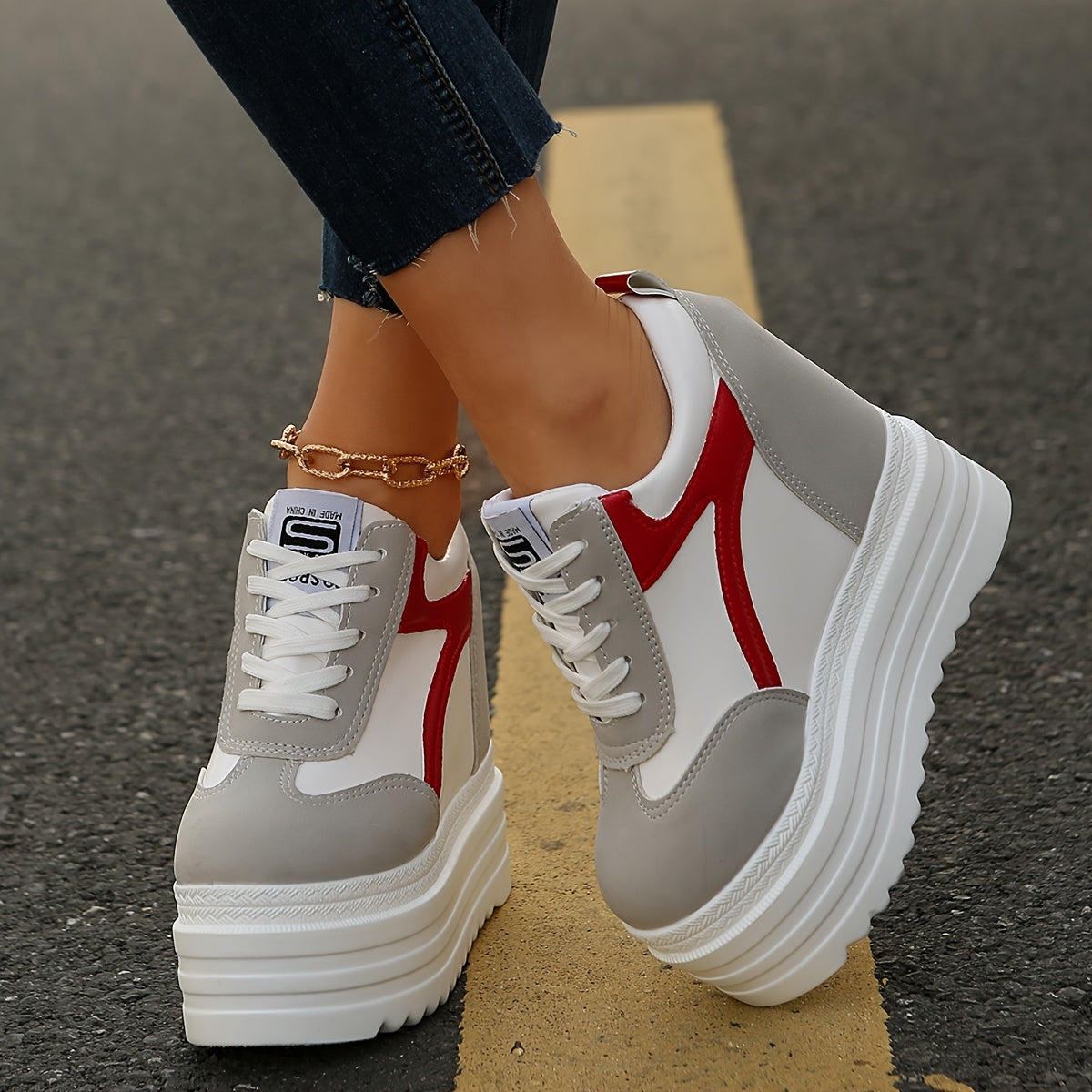 Women's platform sneakers with lace-up closure, fabric lining, lightweight construction, solid color, and low-top design for year-round wear.