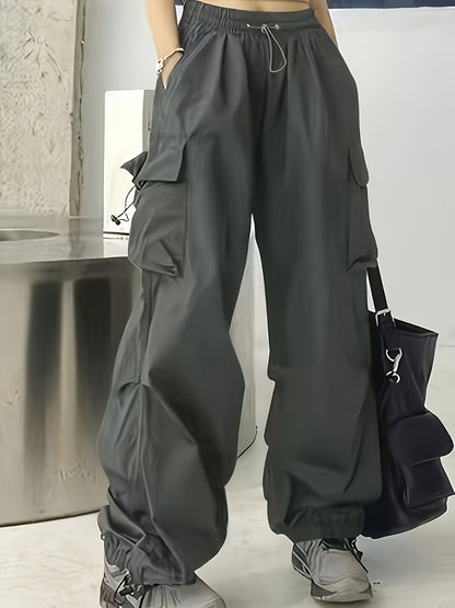 Wide leg cargo pants with flap pockets, drawstring closure. Perfect for spring and summer. Women's casual clothing.