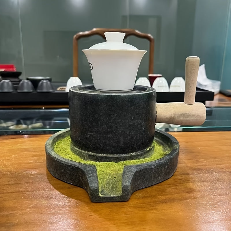 Handcrafted bluestone grinder for tea, coffee, and pepper, along with a matching handmade tea set and stone grinder for matcha. A perfect addition to any household's collection of tea grinding utensils, complete with beautiful graphite ornaments.