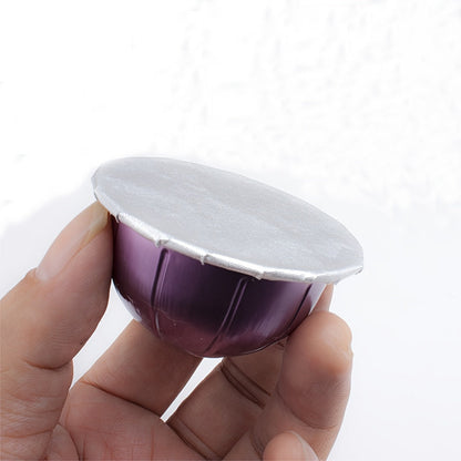 Disposable refillable capsules pods lids with aluminum seals stickers, perfect for Nespresso Vertuo Plus automatic coffee cafe machine maker, measuring 59mm in diameter.