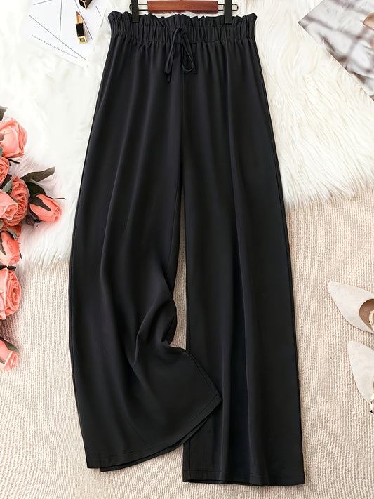 Solid color wide leg pants with paper bag waist and tie front, perfect for spring and summer. Ideal for plus size women.