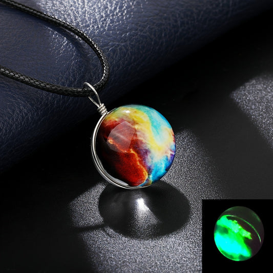 Set of 4 Starry River pendant necklaces featuring dual-sided glass orb and a luminous boho-retro style. Each necklace showcases a cosmic dreamy space gemstone that glows in the dark, making it the perfect accessory for music festivals, travel, and beach