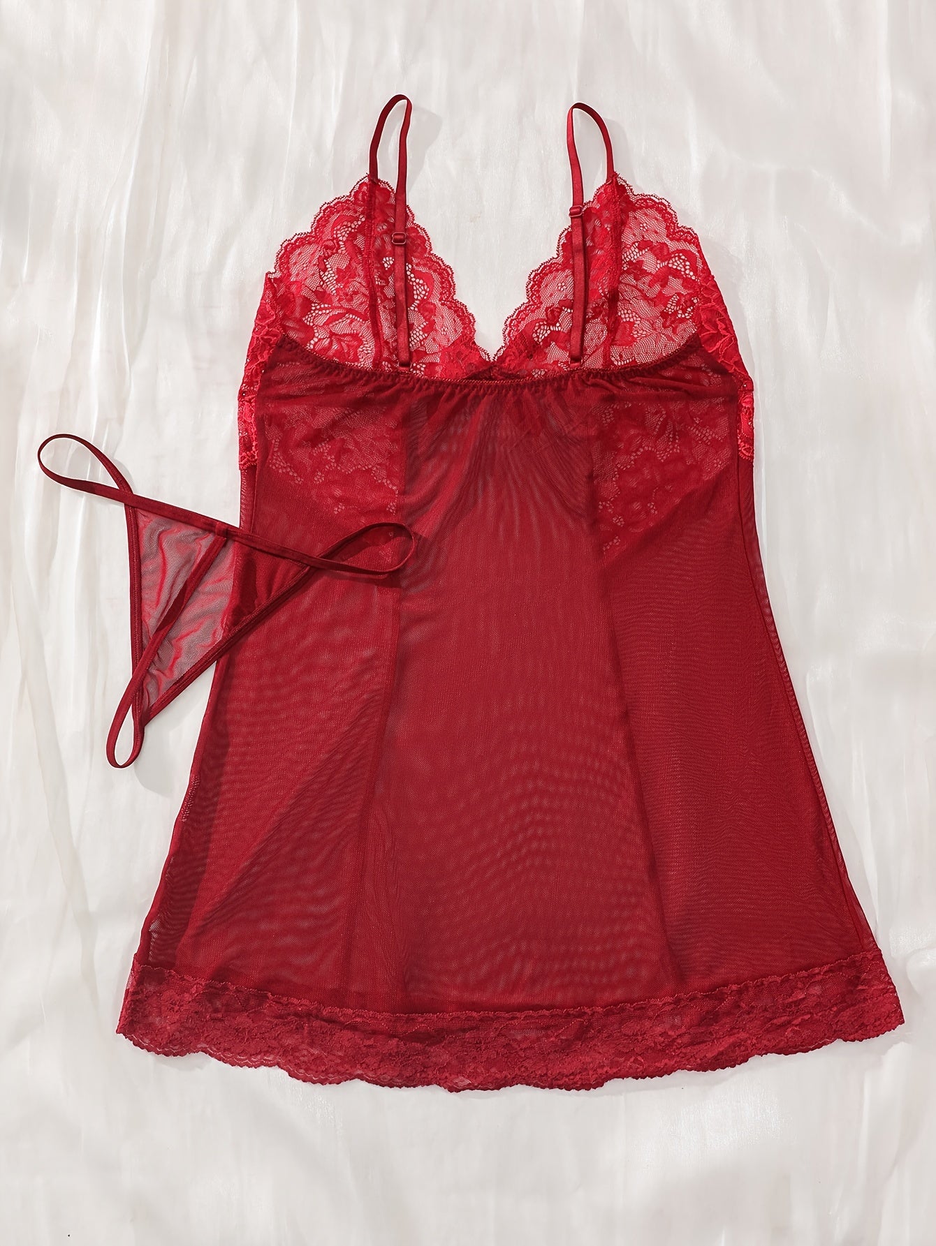 Women's sexy lingerie set features elegant sheer lace and mesh babydoll nightgown with floral detailing, V-neck, ruffled slip dress. Made of a polyester blend with lace accents.