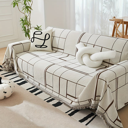 Bohemian sofa cover with tassels, pet-friendly, non-slip, all-season protector for single to four-seater sofas. Suitable for living room and bedroom decor. Machine washable polyester in beige and white striped design.